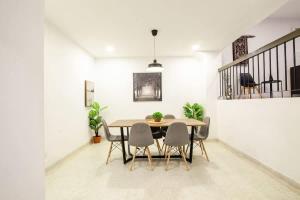 a dining room with a table and chairs at Bukit Damansara Terrace in Kuala Lumpur