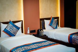 Ένα ή περισσότερα κρεβάτια σε δωμάτιο στο Hotel Aripan