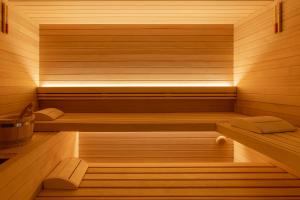 a sauna with wooden walls and wooden floors at Pagoda Lifestyle Hotel in Ischia