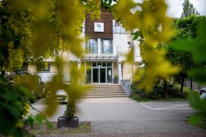 a building with the front door of it at Hotel Aqua Sopot - Destigo Hotels in Sopot