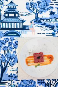 a plate with a piece of food on a plate with at Pagoda Lifestyle Hotel in Ischia