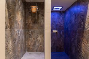 a hallway with a door with a wooden wall at Pagoda Lifestyle Hotel in Ischia