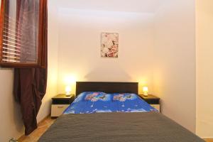 Posteľ alebo postele v izbe v ubytovaní Apartments Sandra 1335