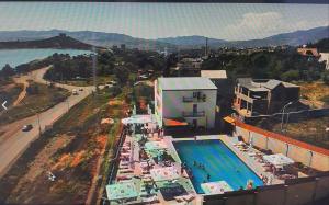 an overhead view of a swimming pool and a building at Hotel Tbilisi sea Terrace in Tbilisi City