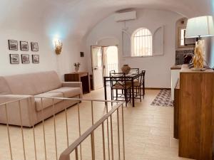 a living room with a couch and a table at Mareincentro Vieste in Vieste