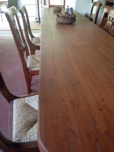 a long wooden table with chairs around it at Rive rosse in Masserano
