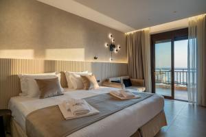 A bed or beds in a room at Hotel Areti