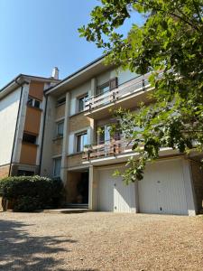a building with two garage doors in front of it at BASISA Bed&Breakfast in San Lazzaro di Savena