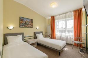 Postel nebo postele na pokoji v ubytování Apart Hotel Tomo FREE PARKING + 37 fotografií