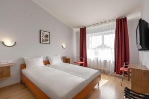 TV a/nebo společenská místnost v ubytování Apart Hotel Tomo FREE PARKING