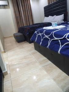 Ένα ή περισσότερα κρεβάτια σε δωμάτιο στο Valley Point Hotel and Suites