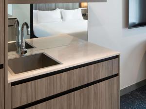 Postel nebo postele na pokoji v ubytování ibis Styles Sydney Central
