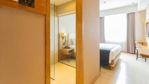 Yellow Star Gejayan Hotelにあるベッド