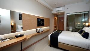 Yellow Star Gejayan Hotelにあるベッド