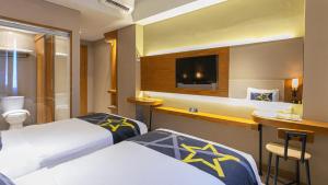 Yellow Star Gejayan Hotelにあるベッド