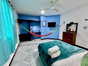 a room with a bed with a hammock in it at Coronaditos 2-Bedroom Appartment in Colonos in Valladolid +20 photos