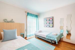 Ένα ή περισσότερα κρεβάτια σε δωμάτιο στο Ofir Beach Lodge by Minho's Guest +14 φωτογραφίες