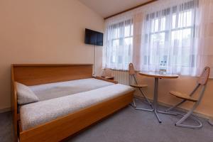 Una cama o camas en una habitación de Kompleks Pilsko-Jontek
