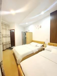 Katil atau katil-katil dalam bilik di 05 Đoàn Thị Điểm Hotel