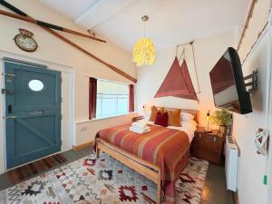 a bedroom with a bed and a green door at Zion Place in Dartmouth