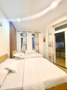 Katil atau katil-katil dalam bilik di 05 Đoàn Thị Điểm Hotel