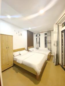 Katil atau katil-katil dalam bilik di 05 Đoàn Thị Điểm Hotel