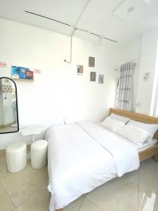 Katil atau katil-katil dalam bilik di 05 Đoàn Thị Điểm Hotel