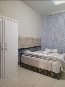 Postel nebo postele na pokoji v ubytování Homestay Aditya