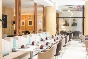 a row of tables and chairs in a restaurant at Crowne Plaza Pune City Centre by IHG in Pune