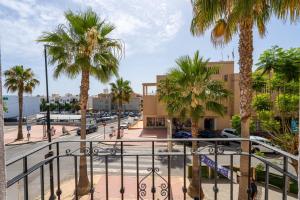 a view of a city street with palm trees at BF Rooms Garrucha in Garrucha