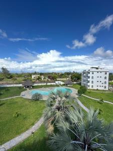 an aerial view of a building and a swimming pool at OceanClose 1&2 Bedroom Malindi in Malindi