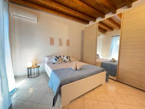 a bedroom with a bed and a bath room at Chalet sul Mare in Ladispoli
