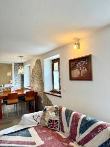 a living room with a couch and a dining room at Folghouse in Folgaria +31 photos