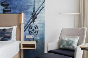 Postel nebo postele na pokoji v ubytování Courtyard by Marriott Munich Garching