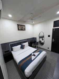 Postel nebo postele na pokoji v ubytování DIAMOND HOTEL