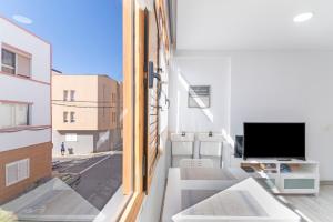 TV a/nebo společenská místnost v ubytování Apartamento Acuario Arinaga