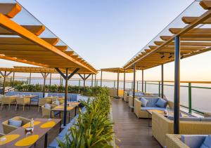 a view of a restaurant with tables and chairs at Bloom Boutique - Rishikesh Hills in Rishīkesh