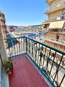 a balcony with a view of a city at Chez Louise, free wi-fi & 5 minutes from InalpiArena in Turin