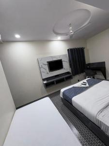 Postel nebo postele na pokoji v ubytování DIAMOND HOTEL