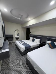 Postel nebo postele na pokoji v ubytování DIAMOND HOTEL