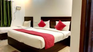 Postel nebo postele na pokoji v ubytování Hotel Rakesh