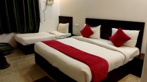 Postel nebo postele na pokoji v ubytování Hotel Rakesh
