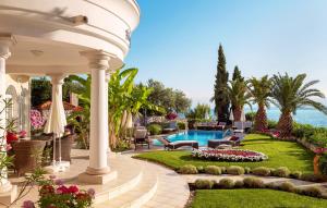 a house with a garden and a swimming pool at Villa Palace Clara Apartment 5 island Krk by Vill in Malinska