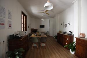 an office with a desk and chairs in a room at La Foresteria dell'Aia in Castelnuovo Berardenga