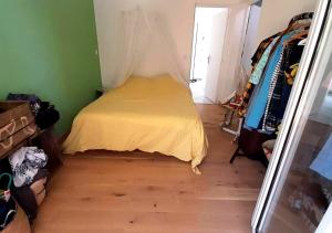 a small bedroom with a bed in a room at Villa avec jardin et piscine privés in Montpellier +14 photos