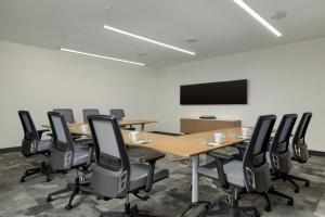 a conference room with a long table and chairs at Element Charleston Airport in Charleston +33 photos
