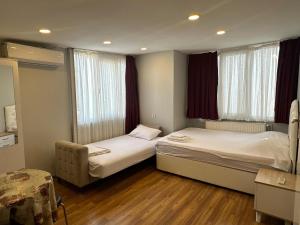 Postel nebo postele na pokoji v ubytování Kaman Home Apart