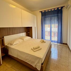Ένα ή περισσότερα κρεβάτια σε δωμάτιο στο Casa Mia