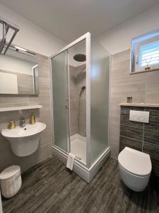 Koupelna v ubytování Apartments Domani