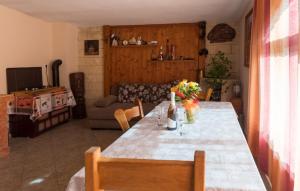 a living room with a table with flowers on it at Country house Desne by Villas Guide in Desne